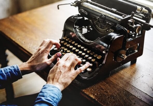 negative-space-vintage-desk-typewriter-man-hands-rawpixel-thumb-1