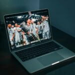 macbook pro on brown wooden table