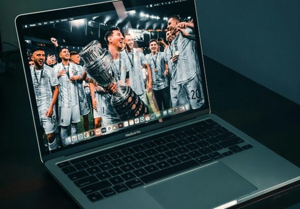 macbook pro on brown wooden table