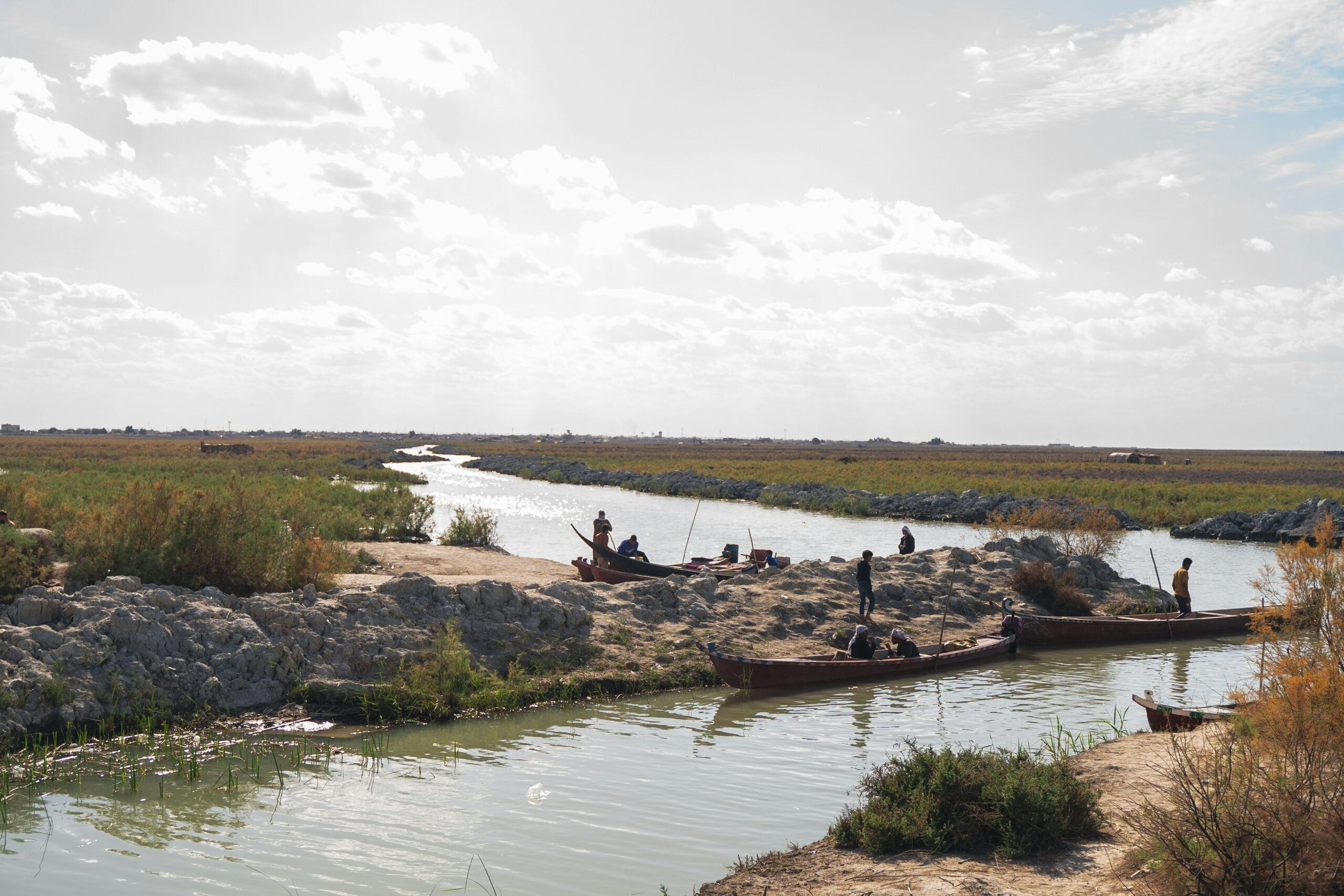 a group of people standing on top of a river: Explore the Oldest civilizations