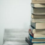 assorted books on wooden table