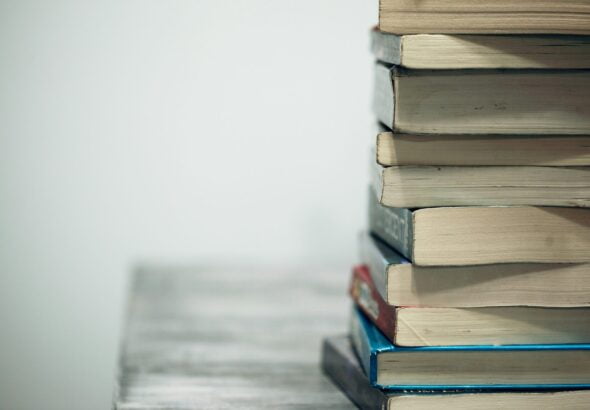 assorted books on wooden table