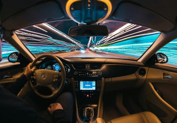 time lapse photography of man riding car